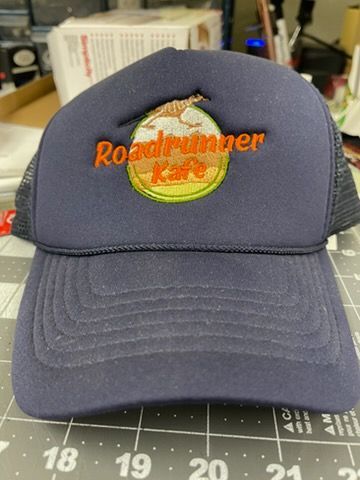 A navy blue trucker hat with an embroidered